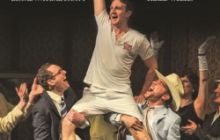 Eric Liddell, fist raised in the air, on the shoulders of sportmen. The image is drawn with a dark background.