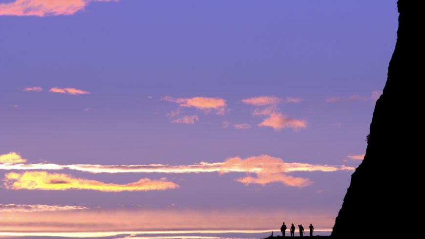 Silhouette of people against sky