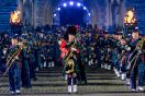 Regimental pipes and drums march through Edinburgh castle gate